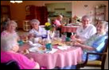 Seniors gathered around a table